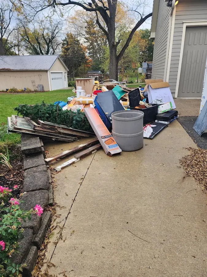 Dumpster being loaded with debris for 10 Yard Dumpster Rental in Aiken